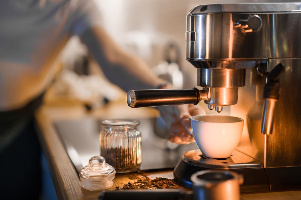 Espresso running from a machine into a glass