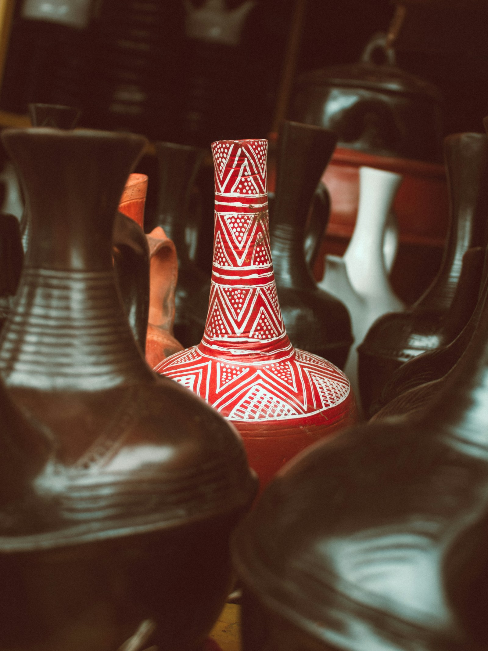 Traditional Ethiopian clay coffee pots displayed for sale on a market table